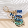 Portachiavi con lettera S in resina blu glitterata con farfalla e nappa in seta - Blu S