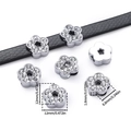 Macro view of crystal flower slider bead showing detailed 12mm size and fit on leather strap - Plum Blossom