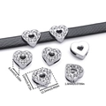Macro shot of rhinestone heart bead accessory with dimensions shown on black leather belt - Full Rhinestone Heart