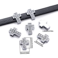 Macro view of rhinestone-encrusted cross slider bead with dimensions for DIY jewelry - Cross