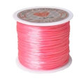 Close-up of bright pink 1mm elastic crystal string roll for DIY jewelry making - Width 1mm, Length 40m (18g) / Pink