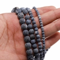 Detail showing various sizes of weathered agate beads with distinct cracked textures for DIY - Black