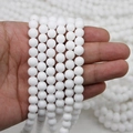 Polished natural white stone round beads for DIY jewelry making held in hand - 8mm / Porcelain White Stone