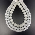 Detailed view of white cat eye stone round beads in 4mm, 6mm, and 8mm sizes for jewelry - White