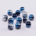Macro view of blue and silver gradient round ABS imitation pearl beads with center holes - Black Blue Multicolor