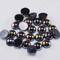 Close-up of iridescent half-round flatback acrylic pearls for DIY jewelry and nail art - Black