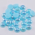 Detailed view of sky blue AB coated half round flatback cabochon acrylic pearls - Lake Blue