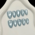 Unghie finte blu cat-eye con effetto magnetico scintillante su punte a forma di mandorla - XS