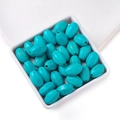 Oval turquoise synthetic beads with brown veins for DIY jewelry making in a white tray - 11*16.5mm (approx. 23 pcs/strand)