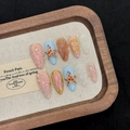 Ocean theme press-on nails with 3D starfish, shells, and pearls on a pearlescent finish - XS / Medium Almond