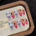 Unghie finte fatte a mano stile clown graffiti forma a mandorla lunga in rosa e blu perla - XS / Mandorla Media (3034)