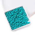 Light blue turquoise round beads with net patterns on a white tray for DIY jewelry - 4*6mm (approx. 86 pcs/strand)