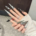 Dark Y2K stiletto press-on nails with silver cat-eye, 3D evil eye, and metal snake accents - L