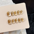 Handmade golden brown cat eye press-on nails with rhinestone accents on display - XS Extra Small / Short Round Nails (3245)