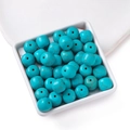 Loose turquoise beads in cube shape for jewelry making displayed in a ceramic tray - 10.5*11.5mm (approx. 36 pcs/strand)