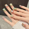 Unghie fatte a mano leopardate a becco d'anatra con fiori bianchi 3D e strass blu - XS / Stile Leopardato Arancione Angel's Realm (646)