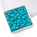 Flat oval turquoise beads with brown veins for DIY jewelry making in a white ceramic dish - 8.5*9.5mm (approx. 39 pcs/strand)