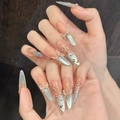 Unghie finte cat-eye blu con fiocco bianco e perle in forma a mandorla lunga - XS / Stiletto Sottile