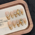 Golden cat eye press-on nails with champagne rhinestones on a luxury wooden tray - XS / Gold Medium Oval