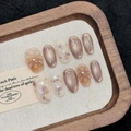 Short oval cat-eye press-on nails with champagne glitter and 3D floral pearls - XS