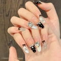 Uñas postizas almendradas rosas con lazos negros, purpurina plateada y diamantes de imitación - XS / Óvalo Largo