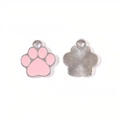 Macro detail of alloy cat paw pendants with pink enamel front and sunburst texture back - Pink