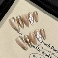 Handmade champagne cat-eye press-on nails in long almond shape with gold foil texture - XS