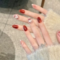 Unghie finte artigianali cat eye con rilievo fragola rossa e fiocco 3D su mandorla - Extra Piccolo (XS)