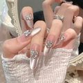 Unghie finte a mandorla fatte a mano con effetto cat eye e fiocchi di strass brillanti - XS / Ovale Lungo