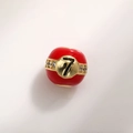 Macro shot of 12mm red enamel charm bead with gold band, sparkling stones and number 7 - Number 7 Billiard Style