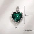 Macro detail of heart-shaped emerald zircon pendant with silver textured edge, 21x13.7mm - A0095 Emerald Heart