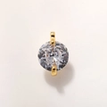 Macro detail of round cut clear zircon pendant with gold plated double claw setting - 8mm Gold Clear A0210