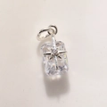 Close-up of rectangular crystal pendant with silver starburst and shiny metal loop - Silver Clear A0210