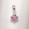 Macro shot of pink planet pendant with heart bail and sparkling zircon in silver finish - Copper White Gold Plated Pink Zirconia