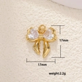 Macro detail of a 17mm gold bow pendant with heart-shaped cubic zirconia and ring - Bowknot Symmetric Heart (23)
