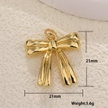 Macro view of gold bow pendant with dimensions and weight specs on a textured surface - Bowknot Smooth Metal (18)
