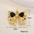 Macro shot of gold-plated bow pendant with black heart zircons and size specifications - Bowknot Double Black Heart (22)
