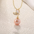 Macro detail of butterfly pendant with baroque pearl and golden beaded chain - Shell Butterfly Baroque Pearl (White)