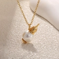 Detail of baroque pearl necklace featuring golden rose floral cap on a stone surface - Hollow Pattern Pearl Pendant (Cream White)
