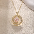 Detailed macro view of a gold flower pendant with a pink pearl and white zircons - Rose Pink Pearl Style (Beige)