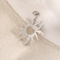 Polished silver sun totem pendant with 12 wave rays on a minimalist textured background - Silver Hollow Style (A0713)