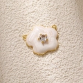 Detail of flower charm with white enamel petals, gold plating and crystal center - White Camellia