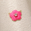 Macro view of pink tulip flower pendant with gold plating and cubic zirconia inlay - Magenta Camellia