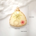 Detail of triangle resin pendant with dried flowers and copper wire wrap 34.7mm - Light Yellow Resin Triangle Dried Flower Style