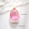 Macro detail of teardrop pink resin pendant with gold wire-wrapped edges and dimensions - Rose Red Resin Waterdrop Faceted Style