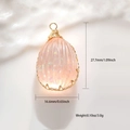 Macro view showing dimensions of pink teardrop flower pendant with gold wire wrap - Jade Resin Waterdrop Sequins Style