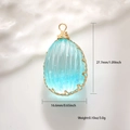 Detailed view of blue dried flower pendant with dimensions 27.7mm by 16.6mm - Light Blue Textured Egg Style