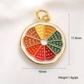 Macro view of a colorful rainbow enamel citrus fruit slice pendant with gold plating - Orange Slice Charm (A0166)