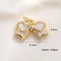 Macro shot of gold-plated bow charm with pink enamel and size details 14.3mm by 8.8mm - White Bowknot Charm (A0166)