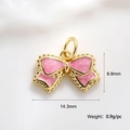 Detailed view of pink enamel bow pendant with gold plating and dimensions 14.3mm by 8.8mm - Pink Bowknot Charm (A0166)